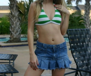 Blonde teenage Jana Jordan undresses to bathing suit top..