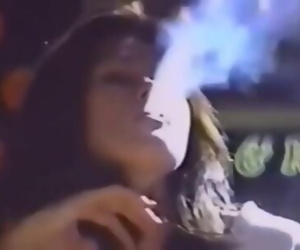 UNKNOWN BEAUTIFUL WOMAN SMOKING OUTSIDE