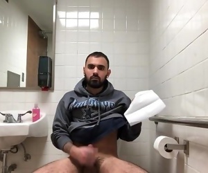 Hidden camera catches young jock cumshot in restroom