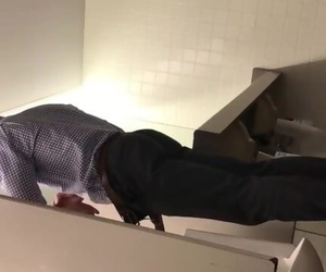 Horny Coworker Caught Pissing Hard