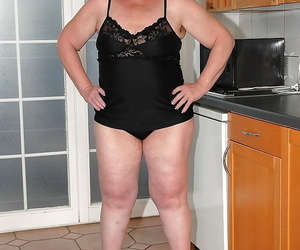 Fatty granny on high high-heeled shoes spreading her arse..