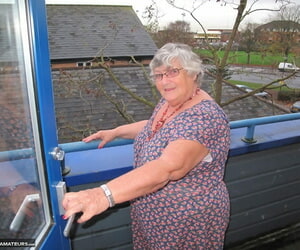 Huge UK nan Grandma Libby bares her knockers on a balcony..