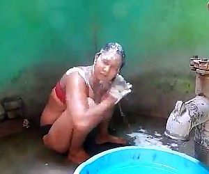 Indian house wife bathing front..