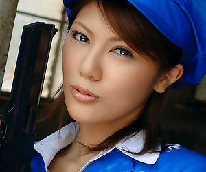 Alluring asian babe with neat ass taking off her police uniform