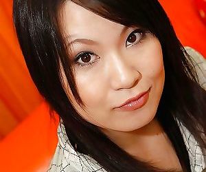 Playful asian babe Kumiko Naruoka undressing and spreading her lower lips