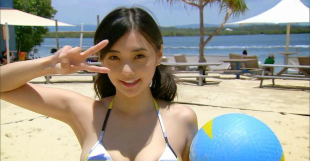 Kurashina Kana beach babe busty holding a bouncy beach ball