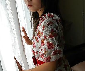 Asian teen Nao Miyazaki undressing and exposing her pussy in close up