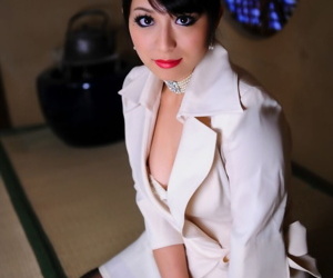 Japanese model exposes her high end brassiere in a business suit and red lips
