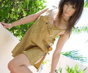 Japanese girl Aya Hirai stands naked while changing her garments