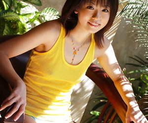 Asian coed Saki Ninomiya uncovering her tiny titties and hairy cunt
