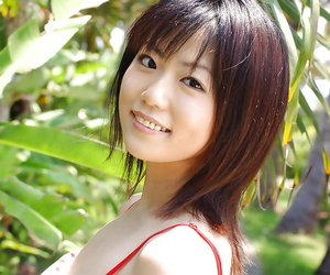 Cute asian babe Saki Ninomiya slipping off her dress and panties outdoor