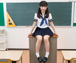 Tiny titted Japanese schoolgirl undressing to stand naked in the classroom