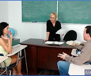 Mature teacher in glasses and sexy coed sharing throbbing cock in class