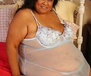 SSBBW Debrina lets fat tits loose from lingerie for nipple licking
