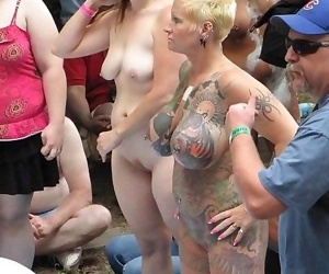 Busty tattoed and pierced mature poser on the public - part 421