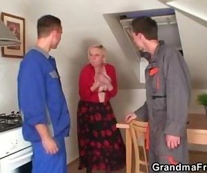 Two repairmen bang busty grandma..