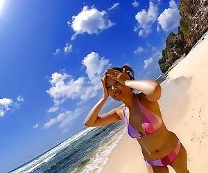 Asian asami ogawa poses on the beach in her bikini - part..