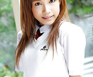Adorable asian schoolgirl Reika Shina stripping off her..