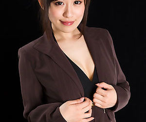 Japanese woman in suit slowly strips to the toes to give a..