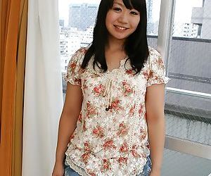 Asian teen Waka Moritani undressing and exposing her pussy..
