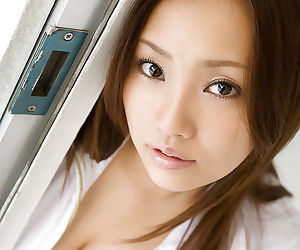 Ravishing asian teen babe Rika Aiuchi uncovering her big..