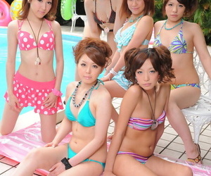 Sweet Japanese girlfriends in sexy swimsuits flaunt their..