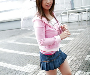 Seductive asian babe in miniskirt uncovering her tempting..
