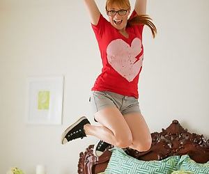 Cute ginger with glasses Penny Pax stripping down naked in..