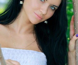 Dark haired Russian teen Kitti A strips totally naked..