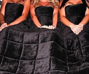 Three ladies lift the sheets and..