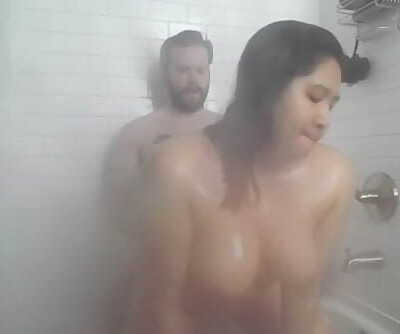 chesty asian fucked in the shower and gets facial