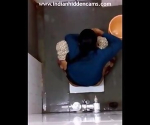 Indian Lady Switching Pad In Bathroom Filmed By Hidden..