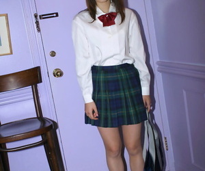 Horny asian schoolgirl Hikaru Koto sliding off her uniform