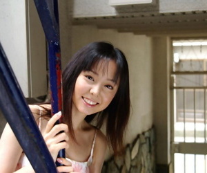 Tasty Japanese teenager Yui Hasumi wears a smile while..