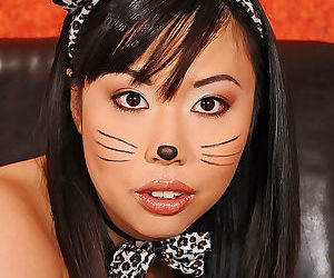 Tattooed Asian Tigerr Benson flaunting big tits while..