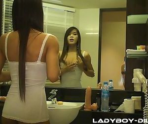 Bootylicious ladyboy Pam sliding a dildo in her tight anus..