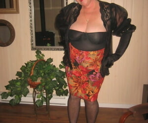 Old fledgling Girdle Queen undresses off her attire while..