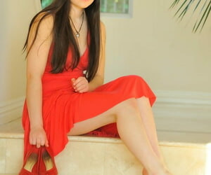 Cute teen Nadine removes her red dress to reveal her tasty..