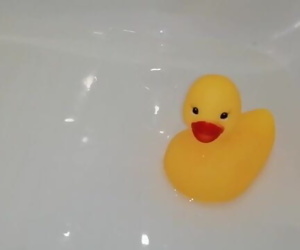 Playing in bathroom with rubber duck