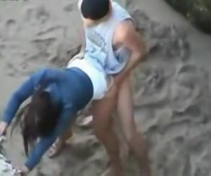 Hot teen couple caught fucking on the beach by a peeper