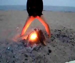teen peeing off thge fire at the..